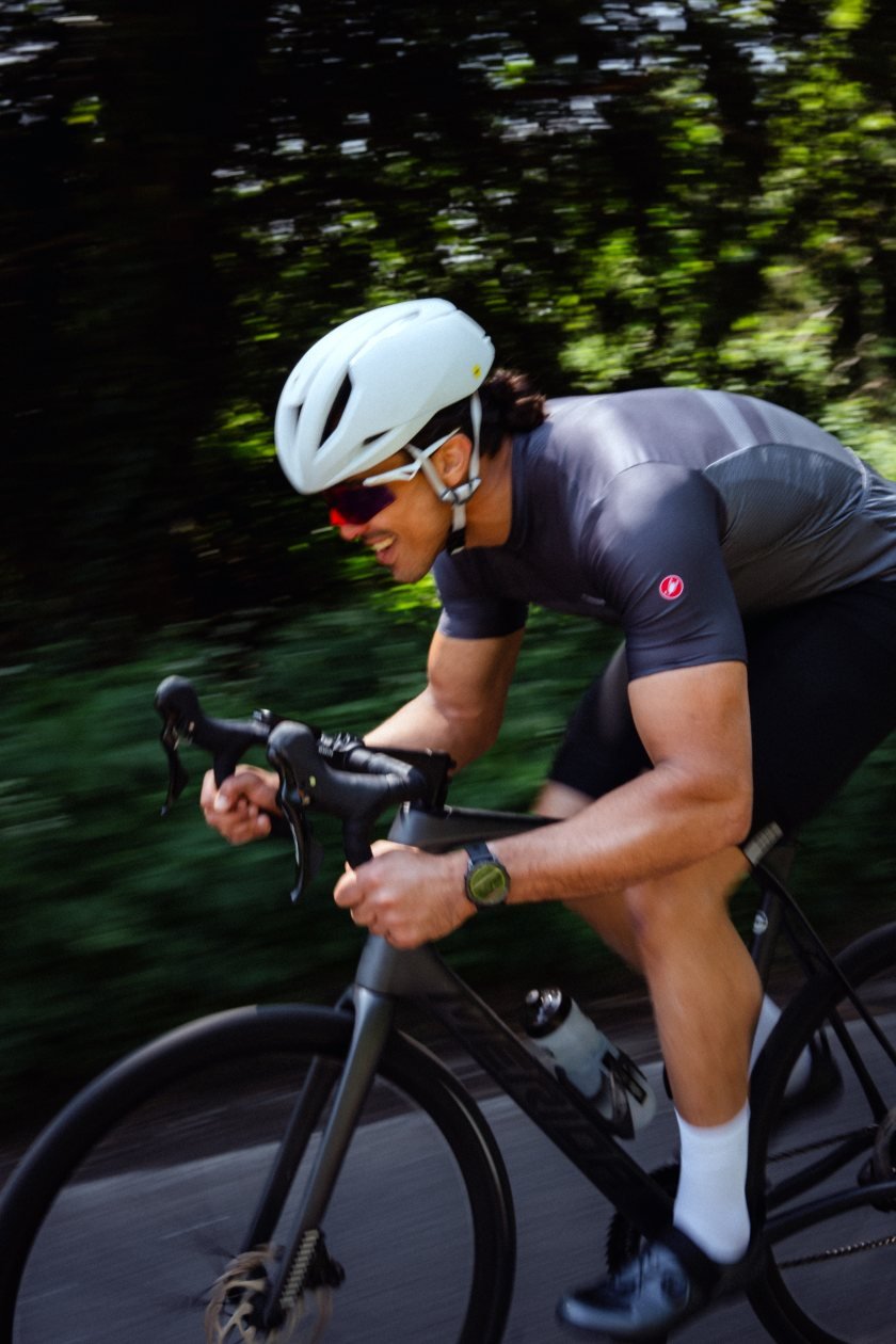 Moe riding a road bike during an endurance training session